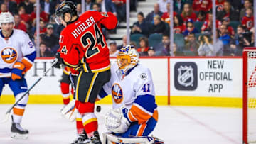 Feb 25, 2016; Calgary, Alberta, CAN; New York Islanders goalie Jaroslav Halak (41) makes a save as Calgary Flames left wing Jiri Hudler (24) tries to score during the third period at Scotiabank Saddledome. New York Islanders won 2-1. Mandatory Credit: Sergei Belski-USA TODAY Sports
