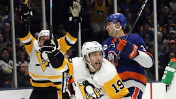 UNIONDALE, NEW YORK - DECEMBER 10: Derick Brassard #19 of the Pittsburgh Penguins celebrates his third period game tying goal against the New York Islanders at NYCB Live at the Nassau Coliseum on December 10, 2018 in Uniondale, New York. The Penguins defeated the Islanders 2-1 in the shootout. (Photo by Bruce Bennett/Getty Images)