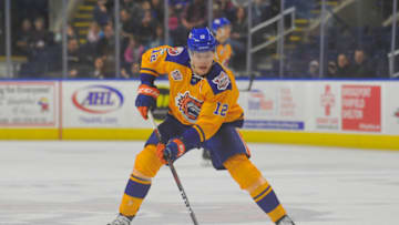 BRIDGEPORT, CT - FEBRUARY 10: Otto Koivula #12 of the Bridgeport Sound Tigers brings the puck up ice during a game against the Utica Comets at Webster Bank Arena on February 10, 2019 in Bridgeport, Connecticut. (Photo by Gregory Vasil/Getty Images)