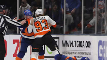 UNIONDALE, NEW YORK - MARCH 09: Josh Bailey #12 of the New York Islanders goes after Jakub Voracek #93 of the Philadelphia Flyers after his third period hit on Johnny Boychuk #55 of the New York Islanders at NYCB Live's Nassau Coliseum on March 09, 2019 in Uniondale, New York. The Flyers defeated the Islanders 5-2. (Photo by Bruce Bennett/Getty Images)