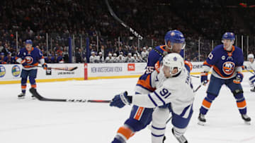 UNIONDALE, NEW YORK - APRIL 01: Johnny Boychuk #55 of the New York Islanders checks John Tavares #91 of the Toronto Maple Leafs during the first period at NYCB Live's Nassau Coliseum on April 01, 2019 in Uniondale, New York. (Photo by Bruce Bennett/Getty Images)