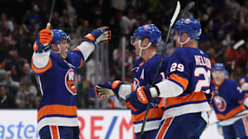 UNIONDALE, NEW YORK - OCTOBER 24: Josh Bailey #12 of the New York Islanders celebrates his second period goal with Anthony Beauvillier #18, and Brock Nelson #29 against the Arizona Coyotes during their game at NYCB Live's Nassau Coliseum on October 24, 2019 in Uniondale, New York. (Photo by Al Bello/Getty Images)