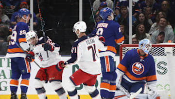 UNIONDALE, NEW YORK - DECEMBER 23: Nathan Gerbe #24 of the Columbus Blue Jackets (L) celebrates his first goal of the season at 9:34 of the second period against the New York Islanders at NYCB Live's Nassau Coliseum on December 23, 2019 in Uniondale, New York. (Photo by Bruce Bennett/Getty Images)