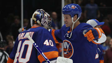 UNIONDALE, NEW YORK - JANUARY 06: Semyon Varlamov #40 of the New York Islanders celebrates his 1-0 shut-out against his former team the Colorado Avalanche and is joined by Matt Martin #17 at NYCB Live's Nassau Coliseum on January 06, 2020 in Uniondale, New York. (Photo by Bruce Bennett/Getty Images)