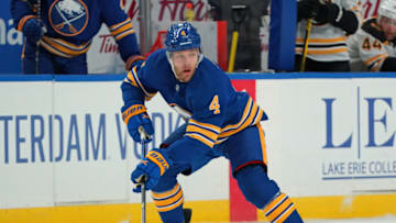 BUFFALO, NY - MARCH 18: Taylor Hall #4 of the Buffalo Sabres skates with the puck during the second period against the Boston Bruins at KeyBank Center on March 18, 2021 in Buffalo, New York. (Photo by Kevin Hoffman/Getty Images)