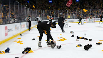 BOSTON, MA MAY 29: Hats rain down after David Pastrnak #88 of the Boston Bruins (not pictured) scores his third goal of the game during the third period against the New York Islanders in Game One of the Second Round of the 2021 Stanley Cup Playoffs at the TD Garden on May 29, 2021 in Boston, Massachusetts. (Photo by Rich Gagnon/Getty Images)