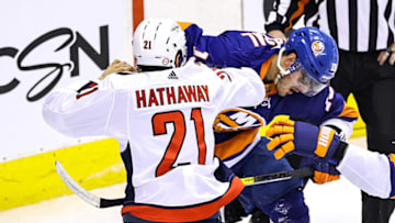 Garnet Hathaway #21 of the Washington Capitals drops the gloves against Mathew Barzal #13 of the New York Islanders (Photo by Elsa/Getty Images)