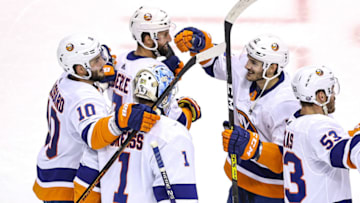 TORONTO, ONTARIO - SEPTEMBER 05: Thomas Greiss #1, Derick Brassard #10 and Mathew Barzal #13 of the New York Islanders celebrate their 4-0 victory against the Philadelphia Flyers in Game Seven of the Eastern Conference Second Round during the 2020 NHL Stanley Cup Playoffs at Scotiabank Arena on September 05, 2020 in Toronto, Ontario. (Photo by Elsa/Getty Images)