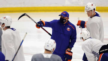 EAST MEADOW, NEW YORK - JANUARY 04: Head coach Barry Trotz of the New York Islanders handles practice during training camp at Northwell Health Ice Center at Eisenhower Park on January 04, 2021 in East Meadow, New York. (Photo by Bruce Bennett/Getty Images)