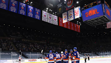 UNIONDALE, NEW YORK - MAY 08: The New York Islanders celebrate a second period goal by Oliver Wahlstrom #26 (R) against the New Jersey Devils at the Nassau Coliseum on May 08, 2021 in Uniondale, New York. (Photo by Bruce Bennett/Getty Images)