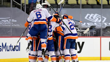 PITTSBURGH, PENNSYLVANIA - MAY 16: The New York Islanders celebrate their 4-3 win over the Pittsburgh Penguins during overtime in Game One of the First Round of the 2021 Stanley Cup Playoffs at PPG PAINTS Arena on May 16, 2021 in Pittsburgh, Pennsylvania. (Photo by Emilee Chinn/Getty Images)
