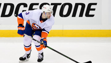 PITTSBURGH, PENNSYLVANIA - MAY 16: Adam Pelech #3 of the New York Islanders handles the puck against the Pittsburgh Penguins during the second period in Game One of the First Round of the 2021 Stanley Cup Playoffs at PPG PAINTS Arena on May 16, 2021 in Pittsburgh, Pennsylvania. (Photo by Emilee Chinn/Getty Images)