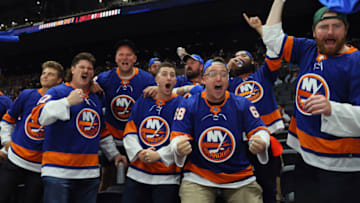 UNIONDALE, NEW YORK - MAY 22: Members of the New York Jets football team including Zach Wilson (L) attend the New York Islanders game against the Pittsburgh Penguins in Game Four of the First Round of the 2021 Stanley Cup Playoffs at the Nassau Coliseum on May 22, 2021 in Uniondale, New York. (Photo by Bruce Bennett/Getty Images)