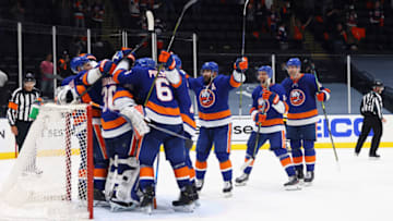 UNIONDALE, NEW YORK - MAY 26: The New York Islanders celebrate a 5-3 victory over the Pittsburgh Penguins in Game Six of the First Round of the 2021 Stanley Cup Playoffs at the Nassau Coliseum on May 26, 2021 in Uniondale, New York. (Photo by Bruce Bennett/Getty Images)
