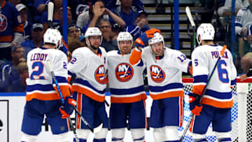 TAMPA, FLORIDA - JUNE 13: Mathew Barzal #13 of the New York Islanders is congratulated by his teammates after scoring a goal against the Tampa Bay Lightning during the second period in Game One of the Stanley Cup Semifinals during the 2021 Stanley Cup Playoffs at Amalie Arena on June 13, 2021 in Tampa, Florida. (Photo by Bruce Bennett/Getty Images)