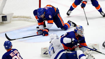 UNIONDALE, NEW YORK - JUNE 19: Ryan Pulock #6 of the New York Islanders blocks a shot by Ryan McDonagh #27 of the Tampa Bay Lightning during the third period in Game Four of the Stanley Cup Semifinals during the 2021 Stanley Cup Playoffs at Nassau Coliseum on June 19, 2021 in Uniondale, New York. (Photo by Rich Graessle/Getty Images)