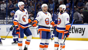 TAMPA, FLORIDA - JUNE 21: Brock Nelson #29, Mathew Barzal #13 and Kyle Palmieri #21 of the New York Islanders warm-up prior to Game Five of the Stanley Cup Semifinals during the 2021 Stanley Cup Playoffs against the Tampa Bay Lightning at Amalie Arena on June 21, 2021 in Tampa, Florida. (Photo by Mike Carlson/Getty Images)