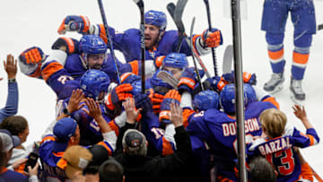 UNIONDALE, NEW YORK - JUNE 23: The New York Islanders celebrate after their 3-2 overtime victory against the Tampa Bay Lightning in Game Six of the Stanley Cup Semifinals during the 2021 Stanley Cup Playoffs at Nassau Coliseum on June 23, 2021 in Uniondale, New York. (Photo by Sarah Stier/Getty Images)