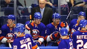 BRIDGEPORT, CONNECTICUT - OCTOBER 02: Head coach Barry Trotz of the New York Islanders handles bench duties against the New Jersey Devils during a preseason game at the Webster Bank Arena at Harbor Yard on October 02, 2021 in Bridgeport, Connecticut. (Photo by Bruce Bennett/Getty Images)