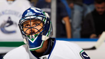 UNIONDALE, NY - OCTOBER 22: Roberto Luongo #1 of the Vancouver Canucks skates in warm-ups prior to the game against the New York Islanders at the Nassau Veterans Memorial Coliseum on October 22, 2013 in Uniondale, New York. The Canucks defeated the Islanders 5-4 in overtime. (Photo by Bruce Bennett/Getty Images)