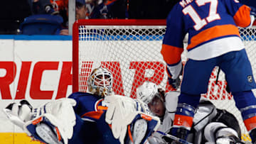 UNIONDALE, NY - NOVEMBER 14: Anze Kopitar #11 of the Los Angeles Kings takes a goaltender interference penalty during the second period against Kevin Poulin #60 of the New York Islanders at the Nassau Veterans Memorial Coliseum on November 14, 2013 in Uniondale, New York. (Photo by Bruce Bennett/Getty Images)