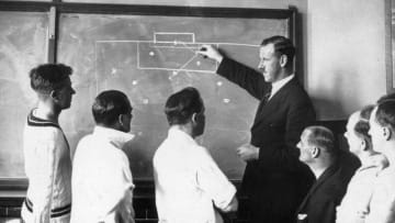17th April 1934: Football referee S F Evans describing the off-side rule with the aid of a blackboard to public schoolmasters at Mill Hill School, London. (Photo by E. Dean/Topical Press Agency/Getty Images)