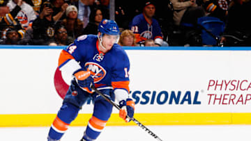 UNIONDALE, NY - JANUARY 29: Thomas Hickey #14 of the New York Islanders in action against the Boston Bruins during their game at the Nassau Veterans Memorial Coliseum on January 29, 2015 in Uniondale, New York. (Photo by Al Bello/Getty Images)