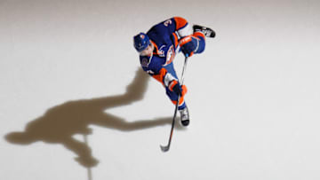 UNIONDALE, NY - MARCH 29: Travis Hamonic #3 of the New York Islanders skates in warm-ups prior to the game against the Detroit Red Wings at the Nassau Veterans Memorial Coliseum on March 29, 2015 in Uniondale, New York. The Islanders defeated the Red Wings 5-4. (Photo by Bruce Bennett/Getty Images)