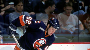 23 Nov 1999: Olli Jokinen #62 of the New York Islanders controls the puck during a game against the Calgary Flames at the Canadien Airlines Saddledome in Calgary, Canada. The Flames defeated the Islanders 3-2. Mandatory Credit: Ian Tomlinson /Allsport