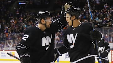 NEW YORK, NY - DECEMBER 18: Anders Lee #27 of the New York Islanders (R) celebrates his goal against the Ottawa Senators at 27 seconds of the second period and is joined by Josh Bailey #12 (L) at the Barclays Center on December 18, 2016 in the Brooklyn borough of New York City. (Photo by Bruce Bennett/Getty Images)