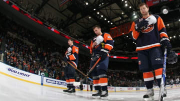 UNIONDALE, NY - NOVEMBER 17: The New York Islanders including Andy Hilbert #11 (R)) salute firefighters prior to their game against the Vancouver Canucks on November 17, 2008 at the Nassau Coliseum in Uniondale, New York. (Photo by Bruce Bennett/Getty Images)