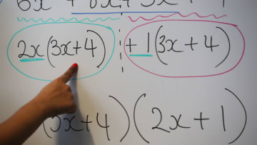 LONDON, ENGLAND - DECEMBER 01: A teacher writes an equation on a whiteboard during a maths lesson at a secondary school on December 1, 2014 in London, England. Education funding is expected to be an issue in the general election in 2015. (Photo by Peter Macdiarmid/Getty Images)