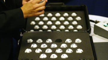 NEW YORK - JULY 22: The National Hockey League draft balls are checked prior to the lottery at the Sheraton New York Hotel and Towers on July 22, 2005 in New York City. (Photo by Andy Marlin/Getty Images for NHLI)