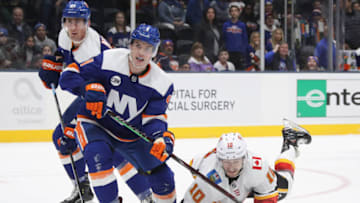 UNIONDALE, NEW YORK - FEBRUARY 26: Derek Ryan #10 of the Calgary Flames skates against Thomas Hickey #4 of the New York Islanders at NYCB Live's Nassau Coliseum on February 26, 2019 in Uniondale, New York. The Flames defeated the Islanders 3-1. (Photo by Bruce Bennett/Getty Images)