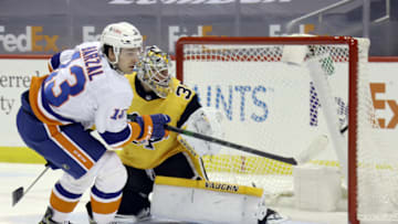 Mar 27, 2021; Pittsburgh, Pennsylvania, USA; New York Islanders center Mathew Barzal (13) scores a goal against Pittsburgh Penguins goaltender Tristan Jarry (35) during the second period at PPG Paints Arena. Mandatory Credit: Charles LeClaire-USA TODAY Sports