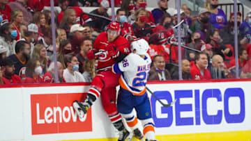 Oct 14, 2021; Raleigh, North Carolina, USA; aNew York Islanders right wing Oliver Wahlstrom (26) checks Carolina Hurricanes left wing Teuvo Teravainen (86) during the first period t PNC Arena. Mandatory Credit: James Guillory-USA TODAY Sports