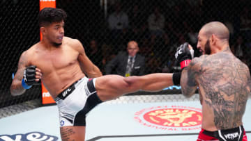 LAS VEGAS, NEVADA - OCTOBER 15: (L-R) Jonathan Martinez kicks Cub Swanson in a bantamweight fight during the UFC Fight Night event at UFC APEX on October 15, 2022 in Las Vegas, Nevada. (Photo by Jeff Bottari/Zuffa LLC)