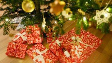 MARTINRODA, GERMANY - DECEMBER 24: Presents underneath a christmas tree on December 24, 2013, in Martinroda, Germany. (Photo by Thomas Trutschel/Photothek via Getty Images)