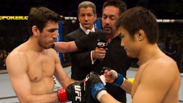 CHARLOTTE, NC - MARCH 31: Kenny Florian (black shorts) def. Takanori Gomi (white/flame shorts) - Submission (rear naked choke) - 2:52 round 3 during UFC Fight Night 21 at Bojangles Coliseum on March 31, 2010 in Charlotte, North Carolina. (Photo by Josh Hedges/Zuffa LLC via Getty Images)