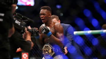 MELBOURNE, AUSTRALIA - OCTOBER 06: Israel Adesanya celebrates his victory over Robert Whittaker between in their Middleweight title bout during UFC 243 at Marvel Stadium on October 06, 2019 in Melbourne, Australia. (Photo by Darrian Traynor/Getty Images)