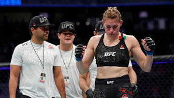 LAS VEGAS, NEVADA - DECEMBER 14: Irene Aldana leaves the Octagon with members of her team after defeating Ketlen Vieira in a bantamweight fight during UFC 245 at T-Mobile Arena on December 14, 2019 in Las Vegas, Nevada. Aldana won by first-round knockout. (Photo by Steve Marcus/Getty Images)