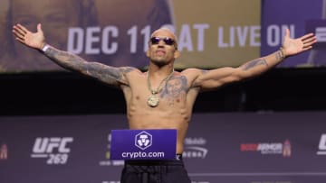 LAS VEGAS, NEVADA - DECEMBER 10: Charles Oliveira of Brazil poses on the scale during the UFC 269 ceremonial weigh-in at MGM Grand Garden Arena on December 10, 2021 in Las Vegas, Nevada. (Photo by Carmen Mandato/Getty Images)