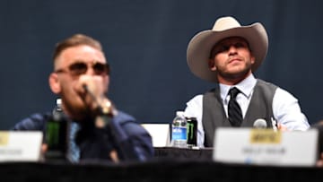 LAS VEGAS, NEVADA - SEPTEMBER 04: (R-L) UFC lightweight title challenger Donald 'Cowboy' Cerrone exchanges words with UFC interim featherweight champion Conor McGregor during the UFC's Go Big launch event inside MGM Grand Garden Arena on September 4, 2015 in Las Vegas, Nevada. (Photo by Jeff Bottari/Zuffa LLC/Zuffa LLC via Getty Images)