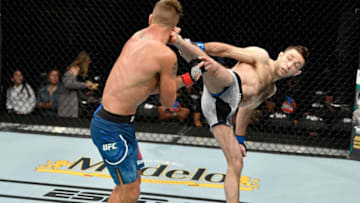 SACRAMENTO, CALIFORNIA - JULY 13: (R-L) Ryan Hall kicks Darren Elkins in their featherweight bout during the UFC Fight Night event at Golden 1 Center on July 13, 2019 in Sacramento, California. (Photo by Jeff Bottari/Zuffa LLC/Zuffa LLC via Getty Images)