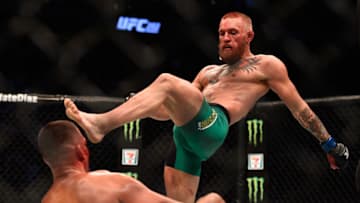 LAS VEGAS, NV - AUGUST 20: (R-L) Conor McGregor of Ireland knocks down Nate Diaz in their welterweight bout during the UFC 202 event at T-Mobile Arena on August 20, 2016 in Las Vegas, Nevada. (Photo by Jeff Bottari/Zuffa LLC/Zuffa LLC via Getty Images)