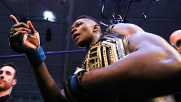 Middleweight title winner Israel Adesanya of New Zealand celebrates after defeating Robert Whittaker of Australia during the middleweight title bout of the UFC 243 fight night in Melbourne on October 6, 2019. (Photo by ASANKA BRENDON RATNAYAKE / AFP) / -- IMAGE RESTRICTED TO EDITORIAL USE - STRICTLY NO COMMERCIAL USE -- (Photo by ASANKA BRENDON RATNAYAKE/AFP via Getty Images)