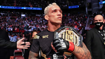 HOUSTON, TEXAS - MAY 15: Charles Oliveira of Brazil holds the belt after defeating Michael Chandler during their Championship Lightweight Bout at the UFC 262 event at Toyota Center on May 15, 2021 in Houston, Texas. (Photo by Carmen Mandato/Getty Images)