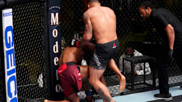 LAS VEGAS, NEVADA - MARCH 13: In this handout image provided by UFC, (R-L) Eryk Anders lands an illegal knee against Darren Stewart of England in a middleweight fight during the UFC Fight Night event at UFC APEX on March 13, 2021 in Las Vegas, Nevada. (Photo by Jeff Bottari/Zuffa LLC via Getty Images)