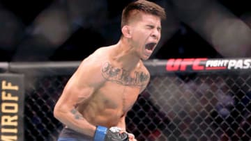 Feb 8, 2020; Houston, Texas, USA; Mario Bautista (blue gloves) after his win against Miles Johns (not pictured) during UFC 247 at Toyota Center. Mandatory Credit: Thomas Shea-USA TODAY Sports