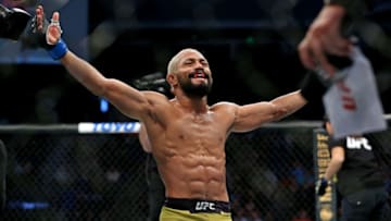 Feb 29, 2020; Norfolk, Virginia, USA; Deiveson Figueiredo (blue gloves) celebrates beating Joseph Benavidez (red gloves) during UFC Fight Night at Chartway Arena. Mandatory Credit: Peter Casey-USA TODAY Sports